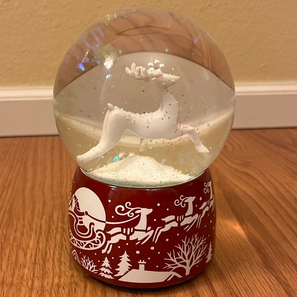 Santa reindeer sleigh musical glitter red white Christmas snow globe